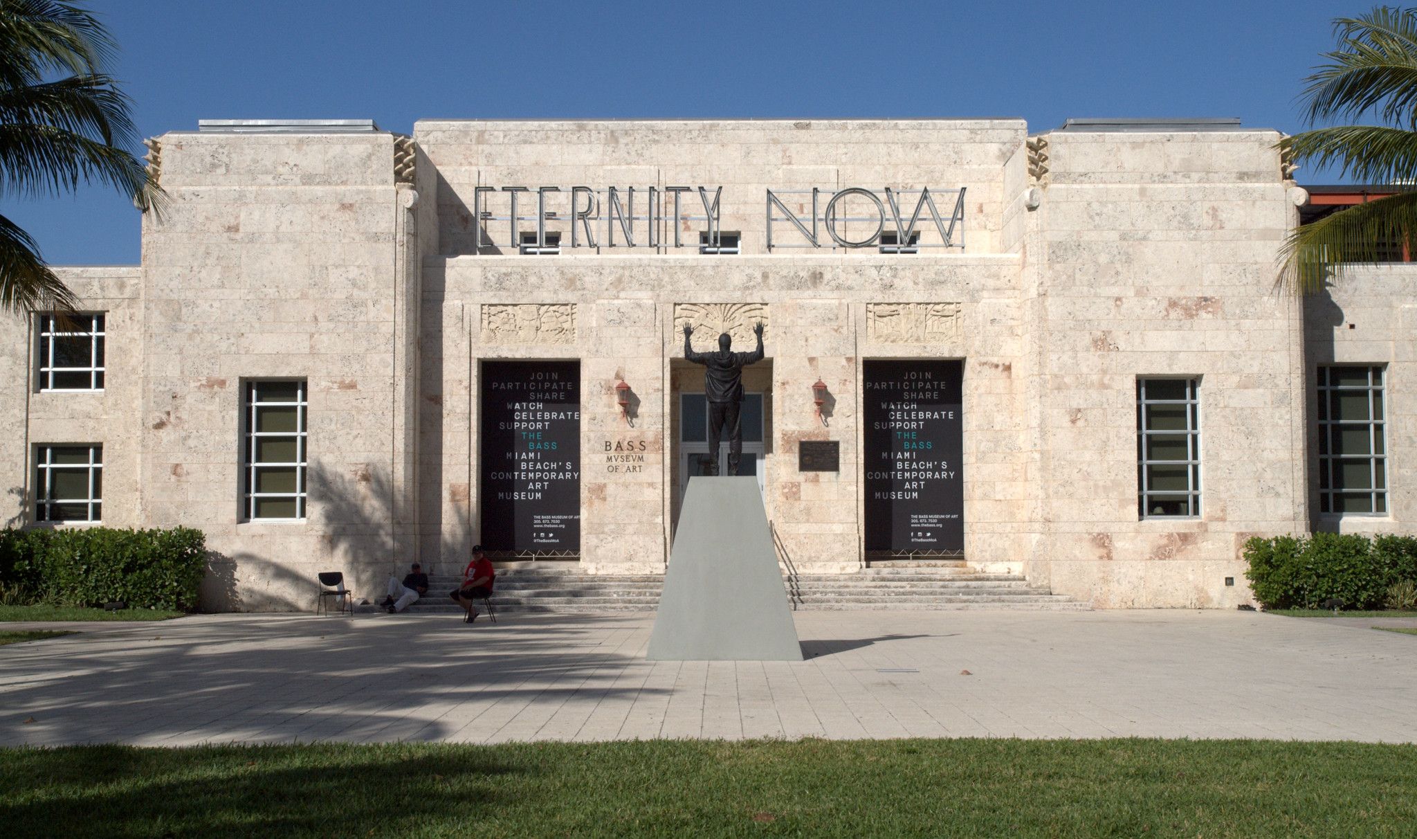 The Bass museum facade in Miami Beach with Sylvie Fleury's ETERNITY NOW sign under a blue sky